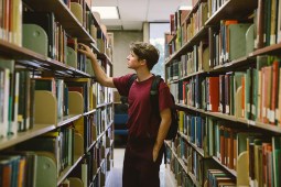 student in library