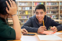 student in library