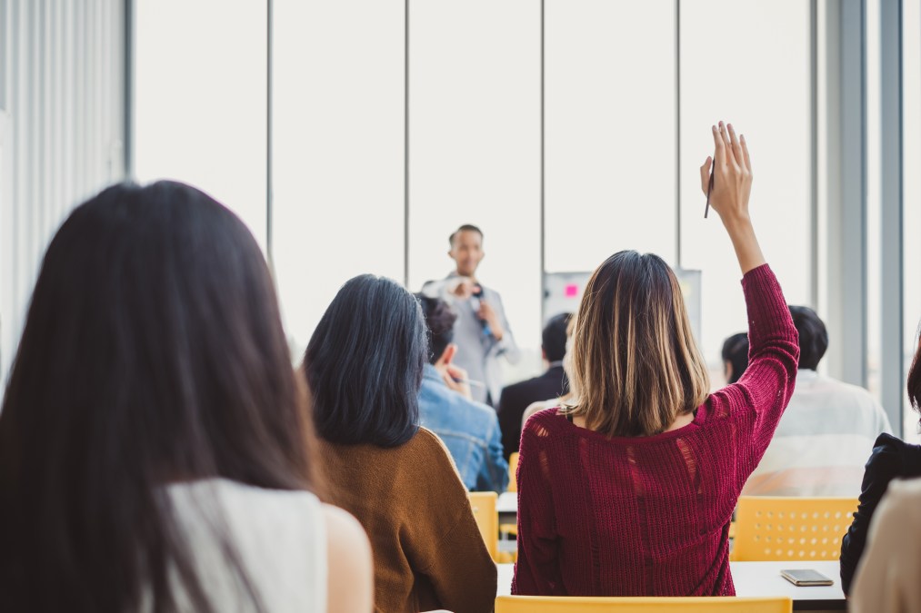 woman raising hand