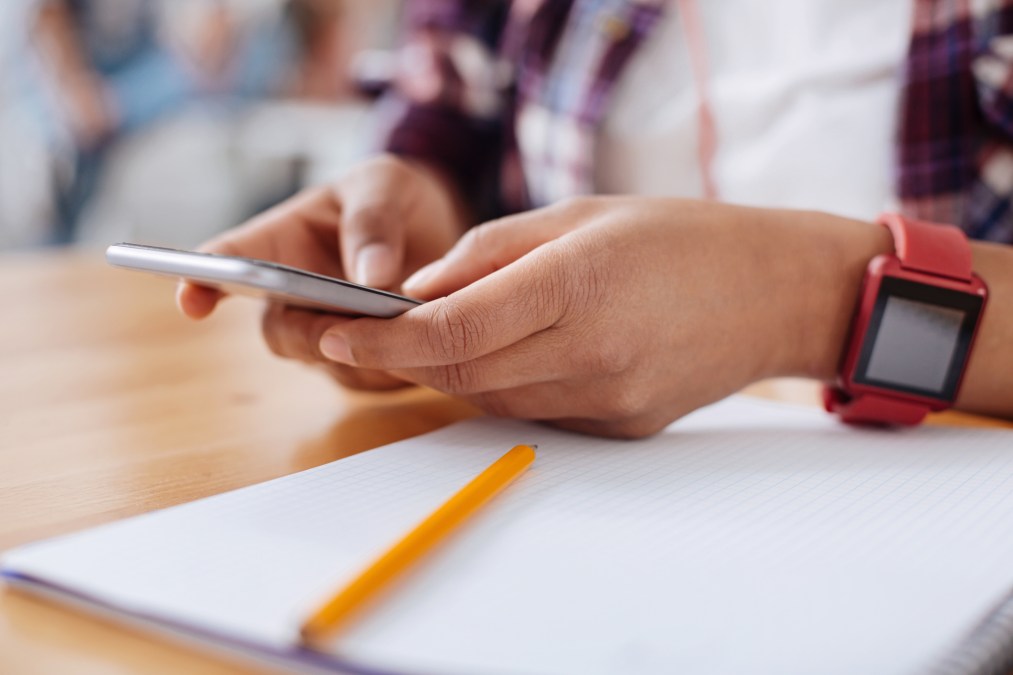 student texting in class