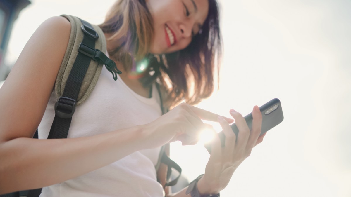 student with smartphone