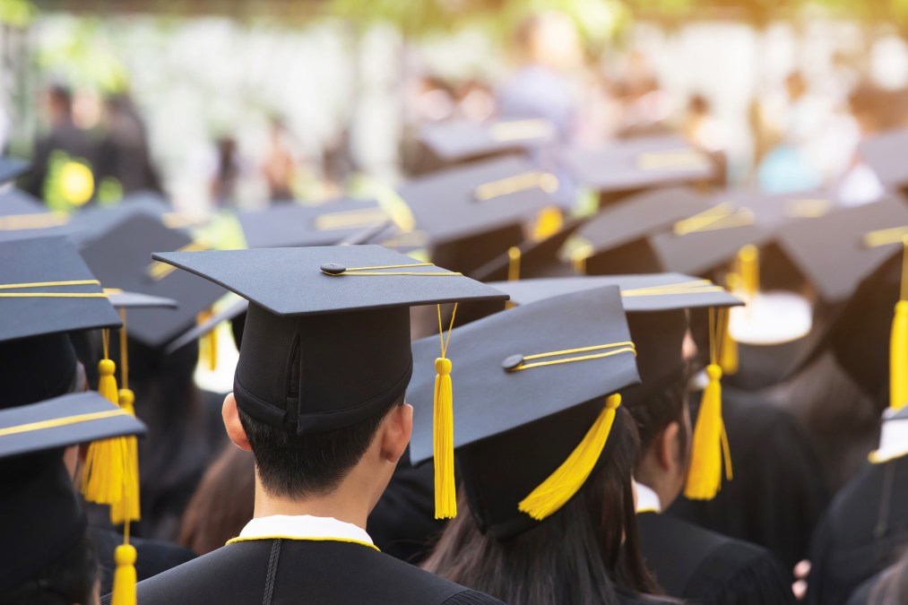 people wearing graduation caps