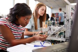 young women doing robotics